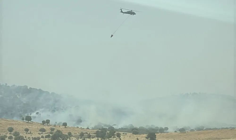 MAZIDAĞI İLÇESİNDE MEYDANA GELEN ORMAN YANGININA HELİKOPERLER DE MÜDAHALE EDİYOR